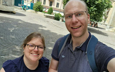 Self-guided tour participants exploring a historic square in Geneva.