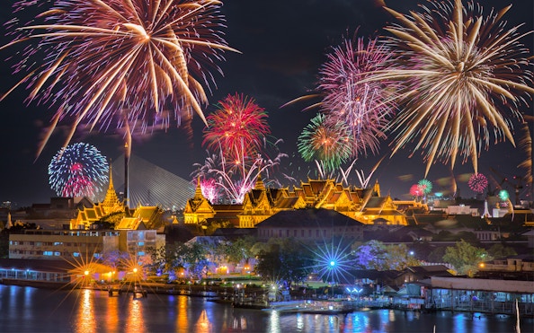 Fireworks over Bangkok's Grand Palace at night, highlighting Promotion Group Saver Pack.