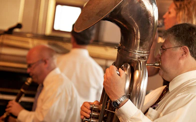 Musicians playing jazz instruments on a riverboat cruise in New Orleans.