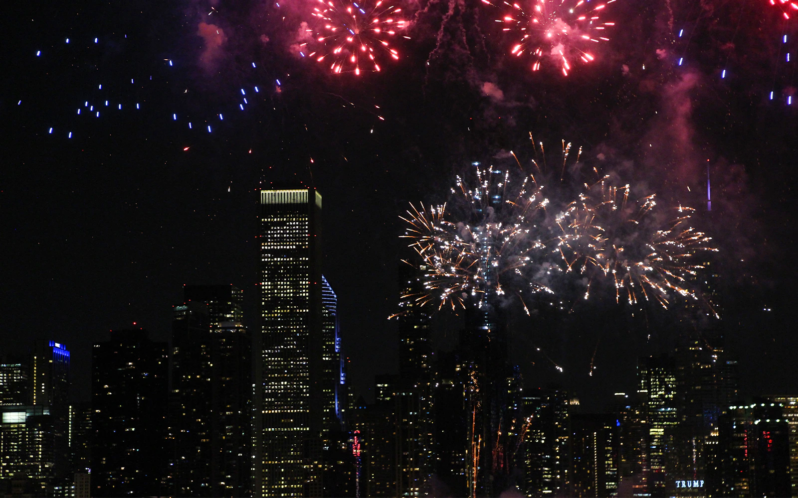 Fireworks over Chicago skyline during dinner cruise.