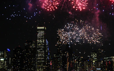 Fireworks over Chicago skyline during dinner cruise.