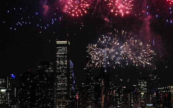 Fireworks over Chicago skyline during dinner cruise.