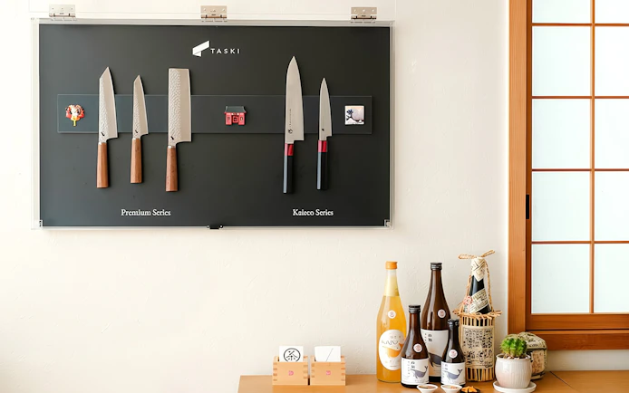 Knives and cooking wines displayed at Tokyo Ramen & Gyoza Cooking Class.