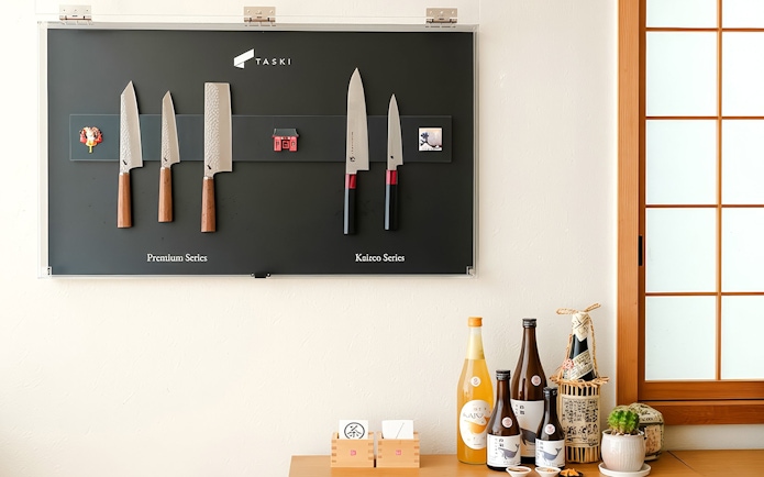 Knives and cooking wines displayed at Tokyo Ramen & Gyoza Cooking Class.