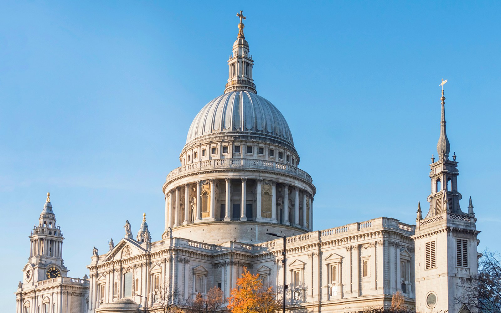 St Paul’s Cathedral dome and towers in London against a clear blue sky.
