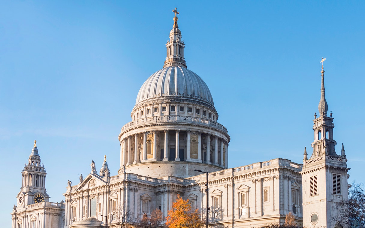 St Paul’s Cathedral dome and towers in London against a clear blue sky.