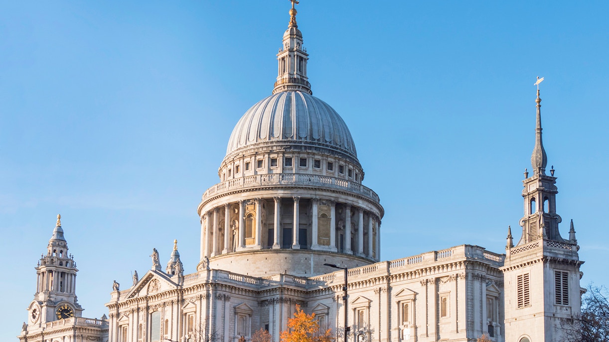St Paul’s Cathedral dome and towers in London against a clear blue sky.