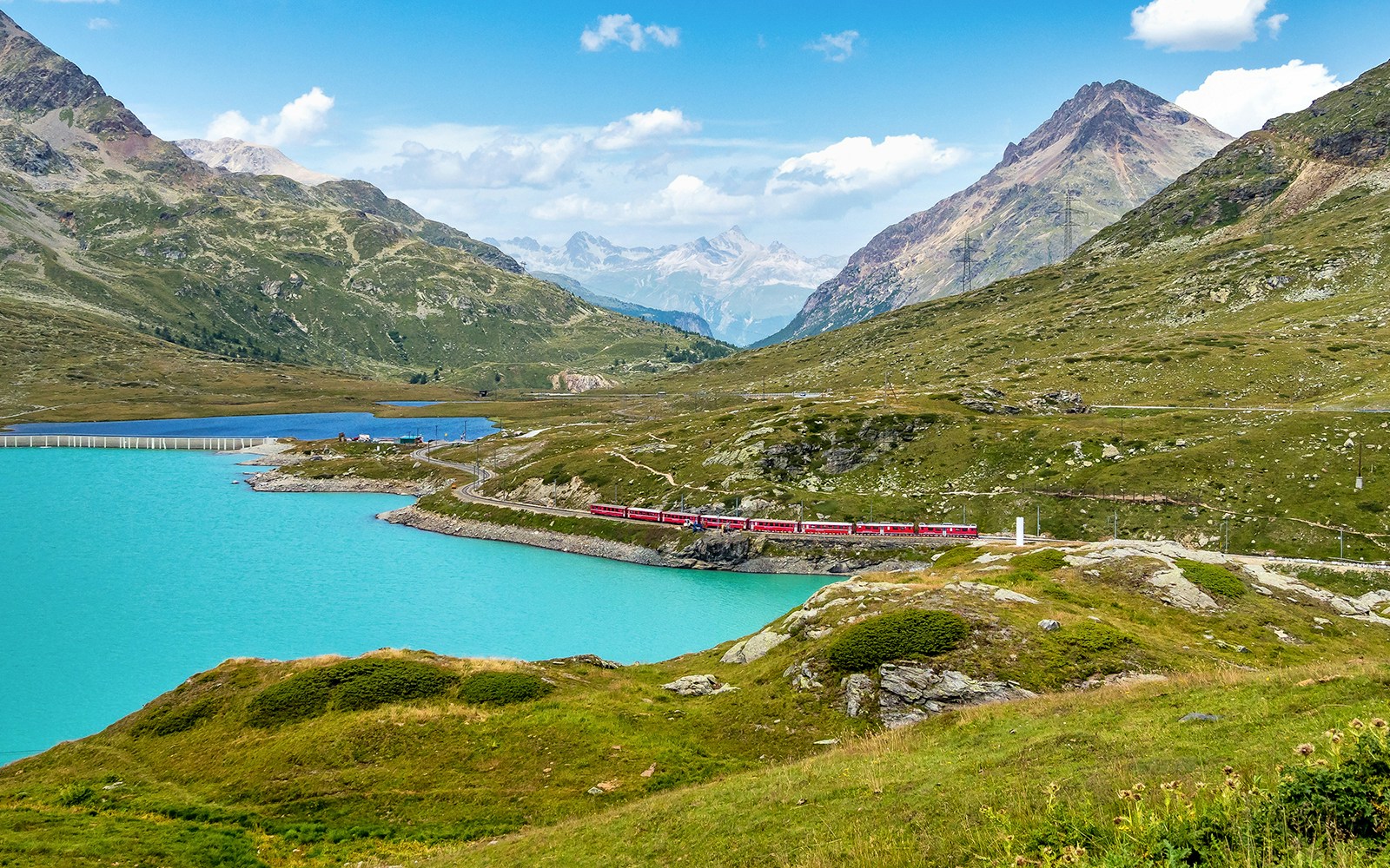 Bernina Express at the White Lake in Ospizio Bernina, Engadin, Switzerland