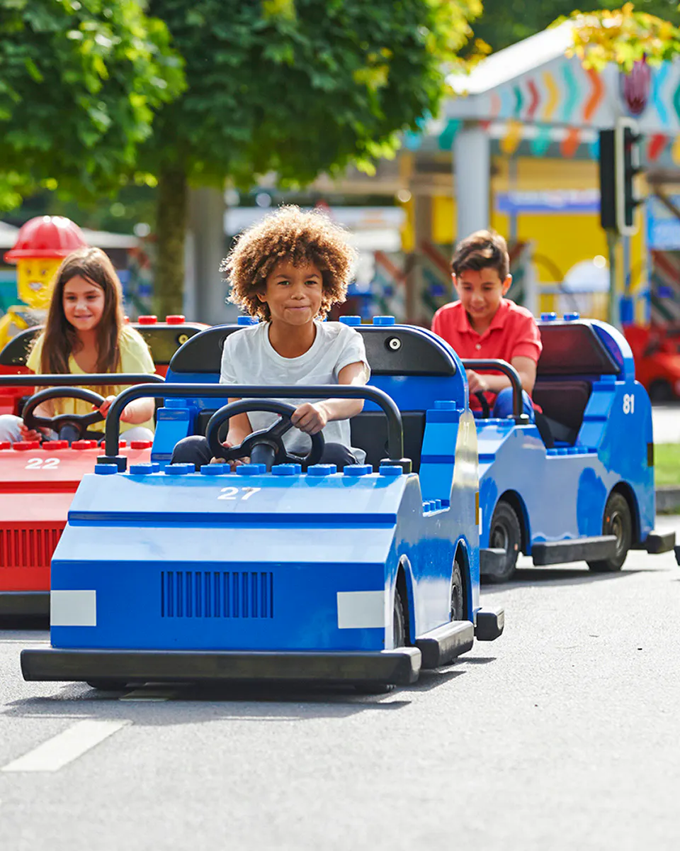 Children driving mini cars at Legoland Windsor.