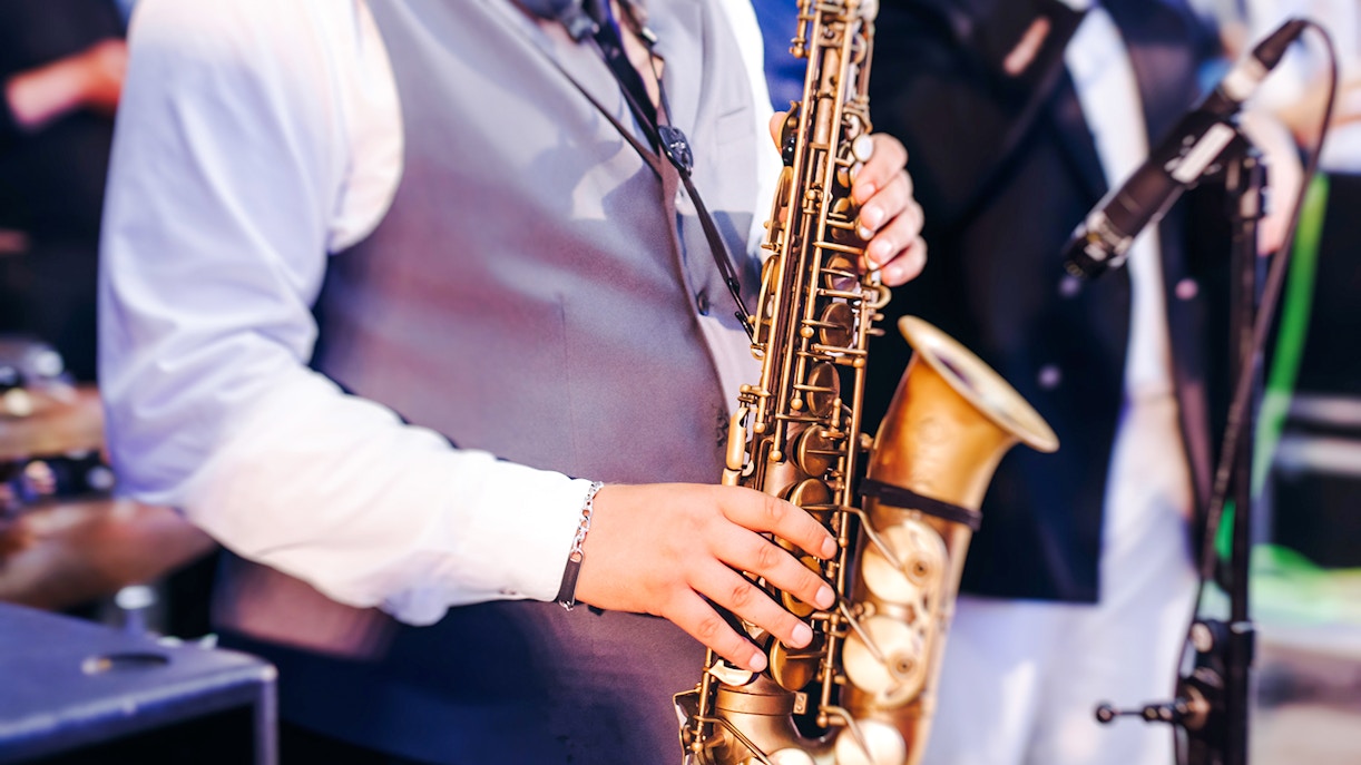 Musician playing saxophone at Paris Jazz Festival.