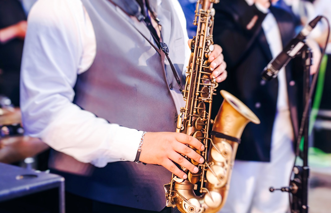 Musician playing saxophone at Jazz Festival.