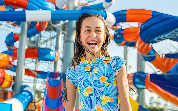 Child enjoying water slides at WhiteWater World, Gold Coast.