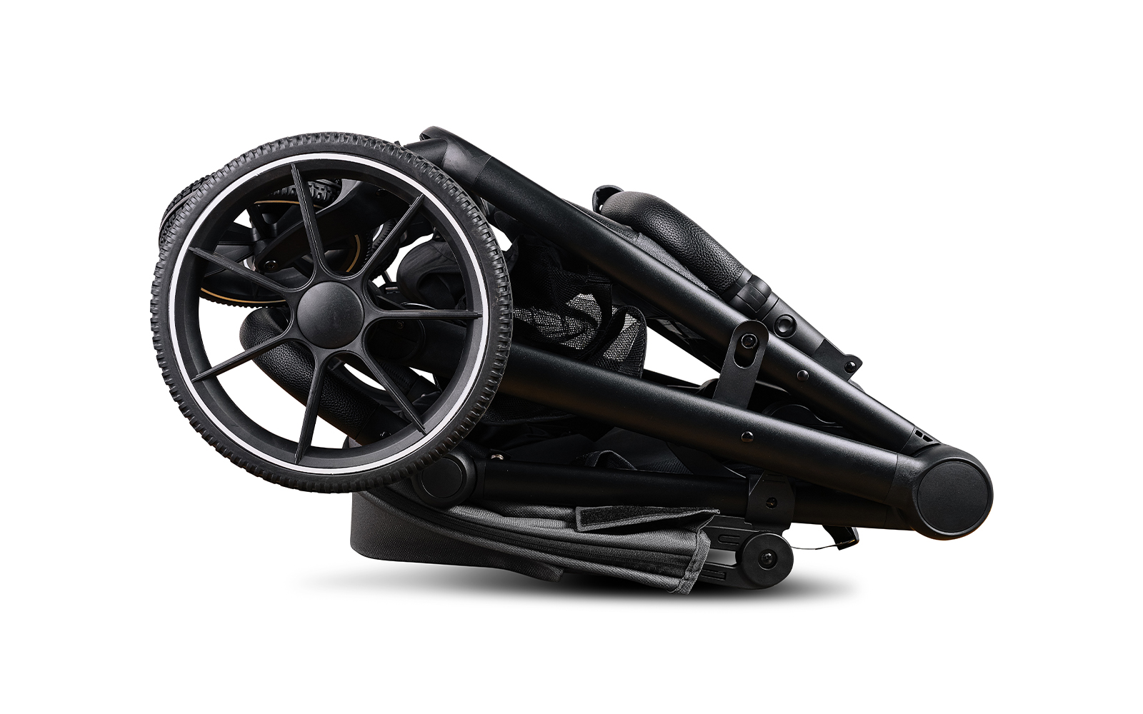 Folded baby stroller on white background.