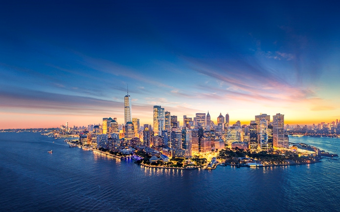 New York City skyline at sunset with One World Trade Center.