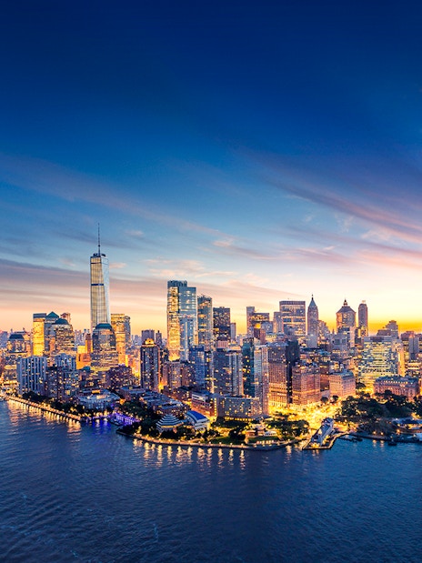 New York City skyline at sunset with One World Trade Center.