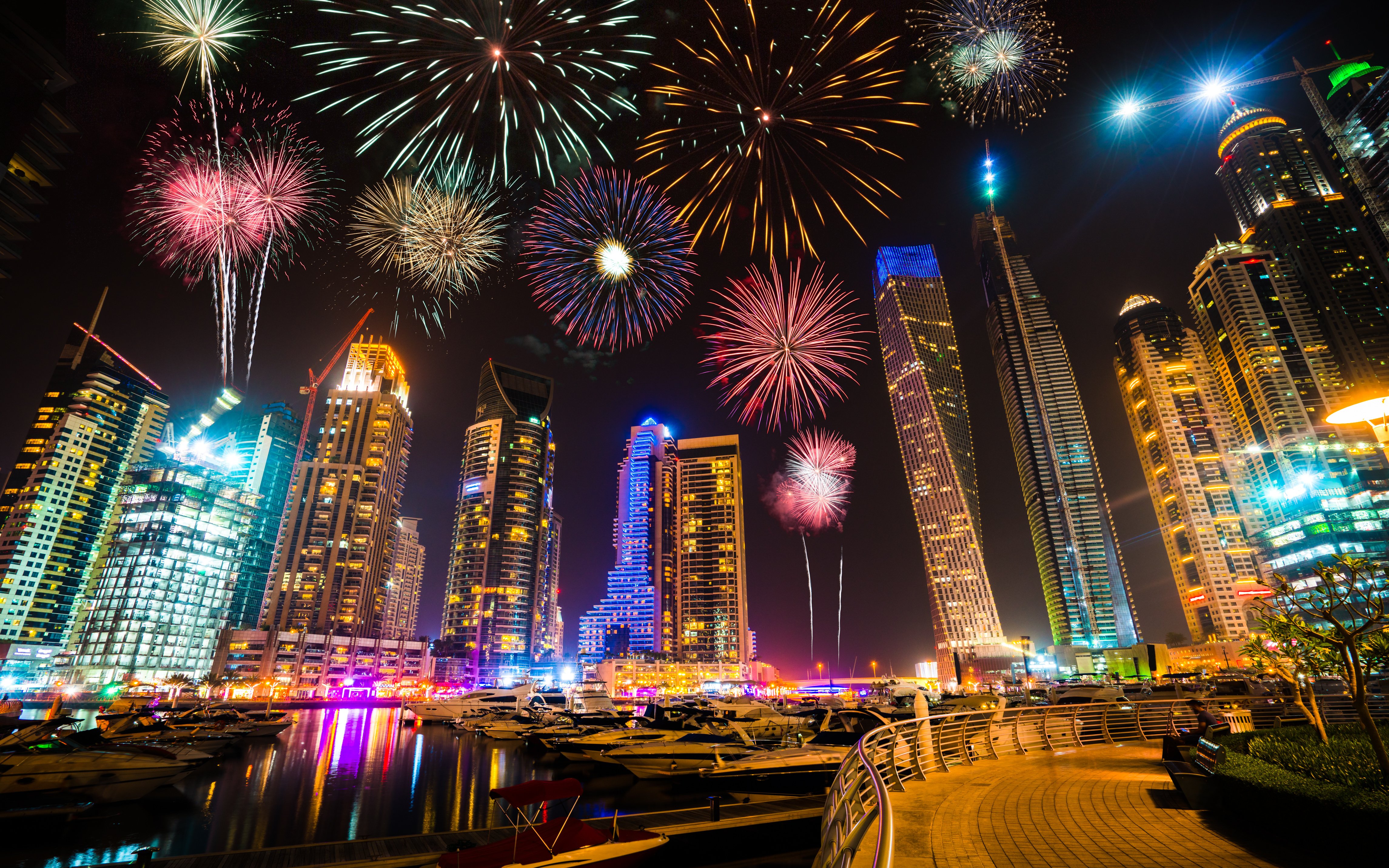 Fireworks over Dubai Marina skyline at night, UAE.