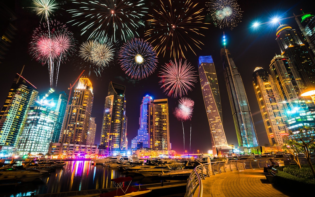 Fireworks over Dubai Marina skyline at night, UAE.
