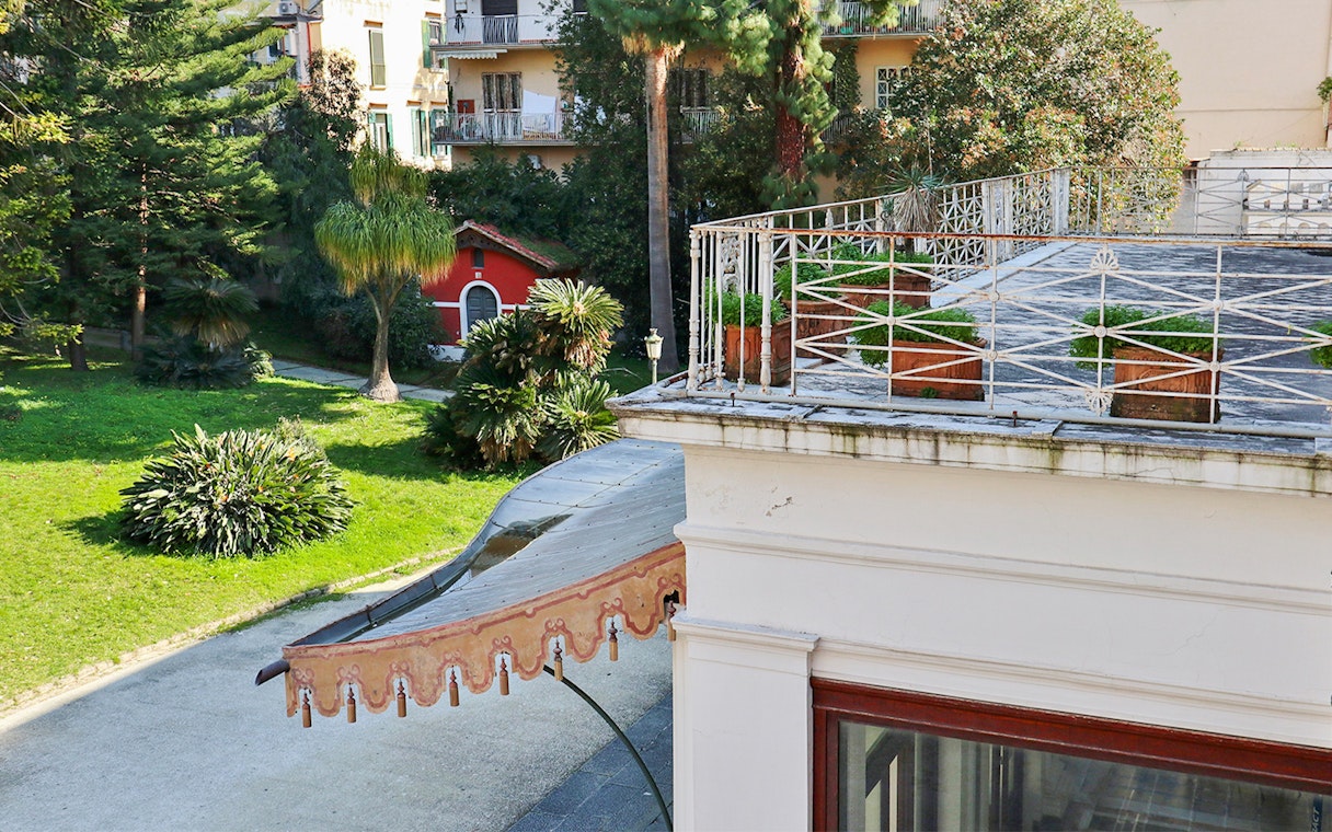 Villa Pignatelli garden view with terrace and greenery in Naples, Italy.