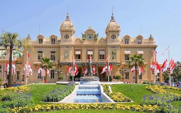 Monaco Casino with gardens and fountain, viewed from Nice.