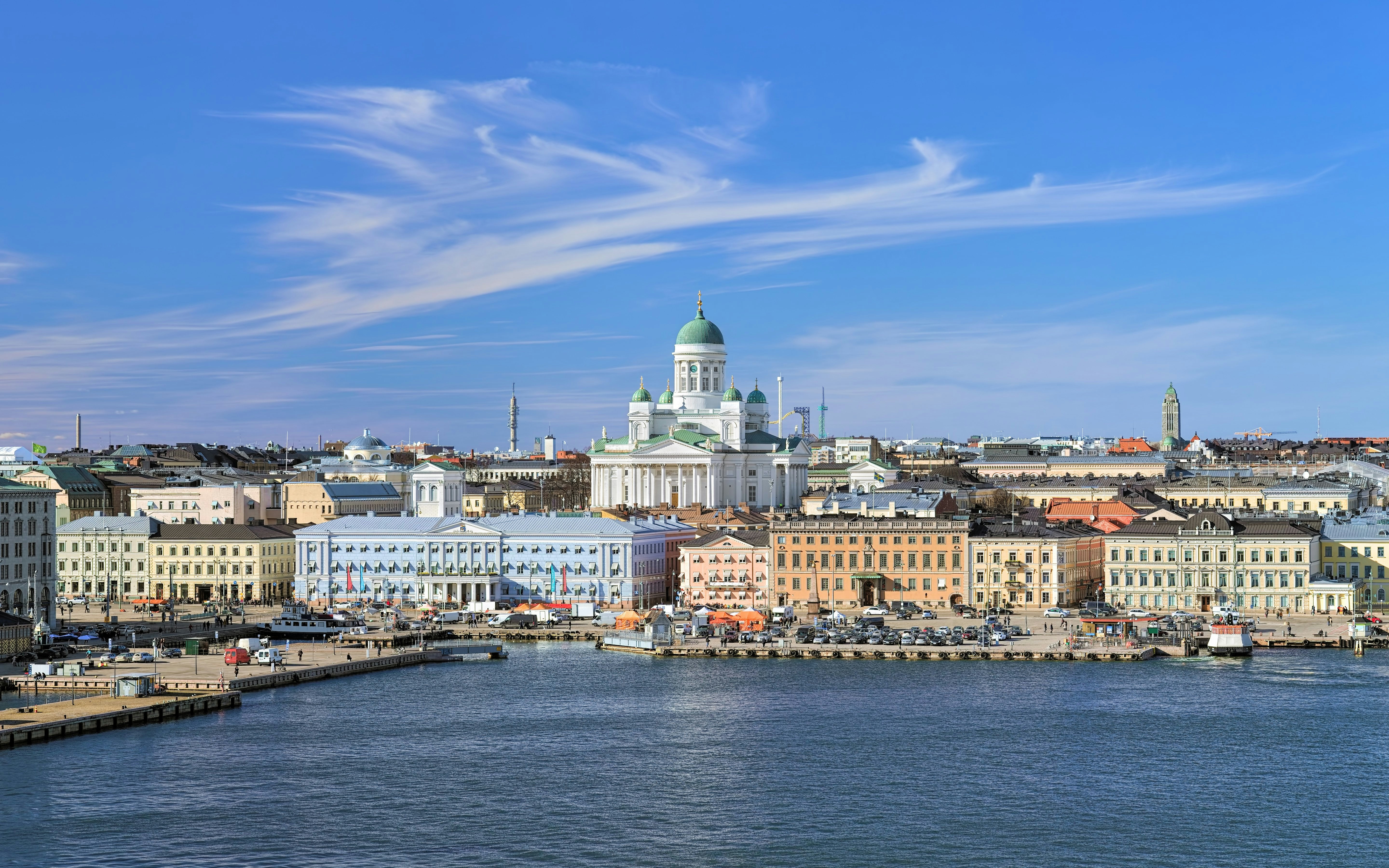 Helsinki cityscape with Cathedral, South Harbor, and Market Square under cirrus clouds.