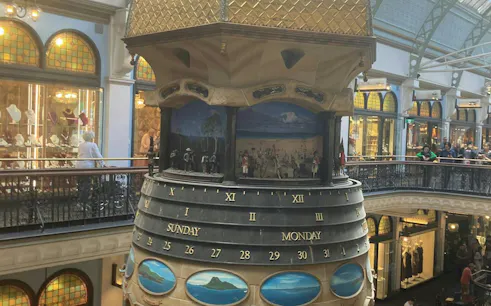Clock tower inside Queen Victoria Building, Sydney, featuring historical dioramas.