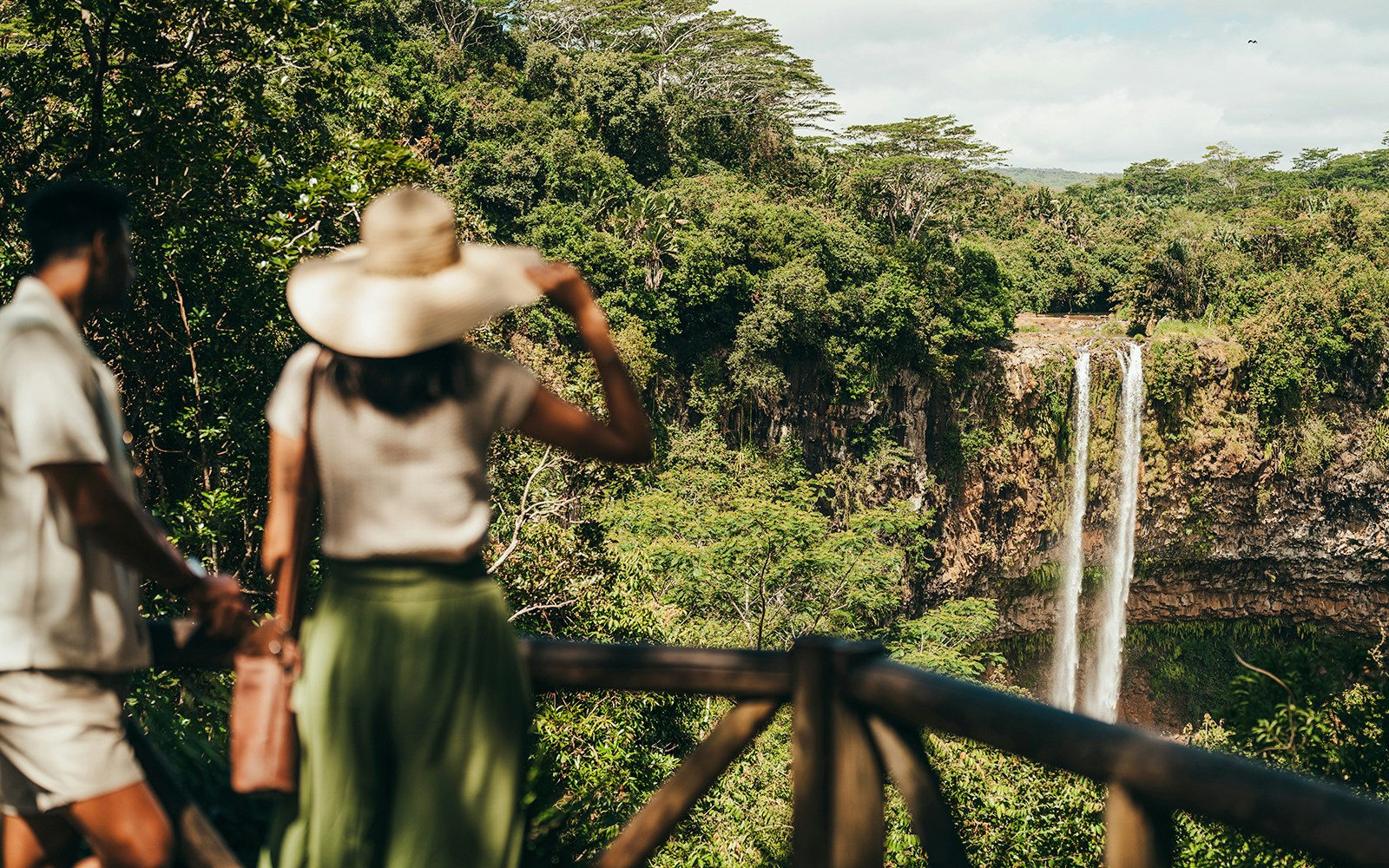 Visitors viewing Chamarel Waterfall on the 7 Coloured Earth plantation tour in Mauritius.
