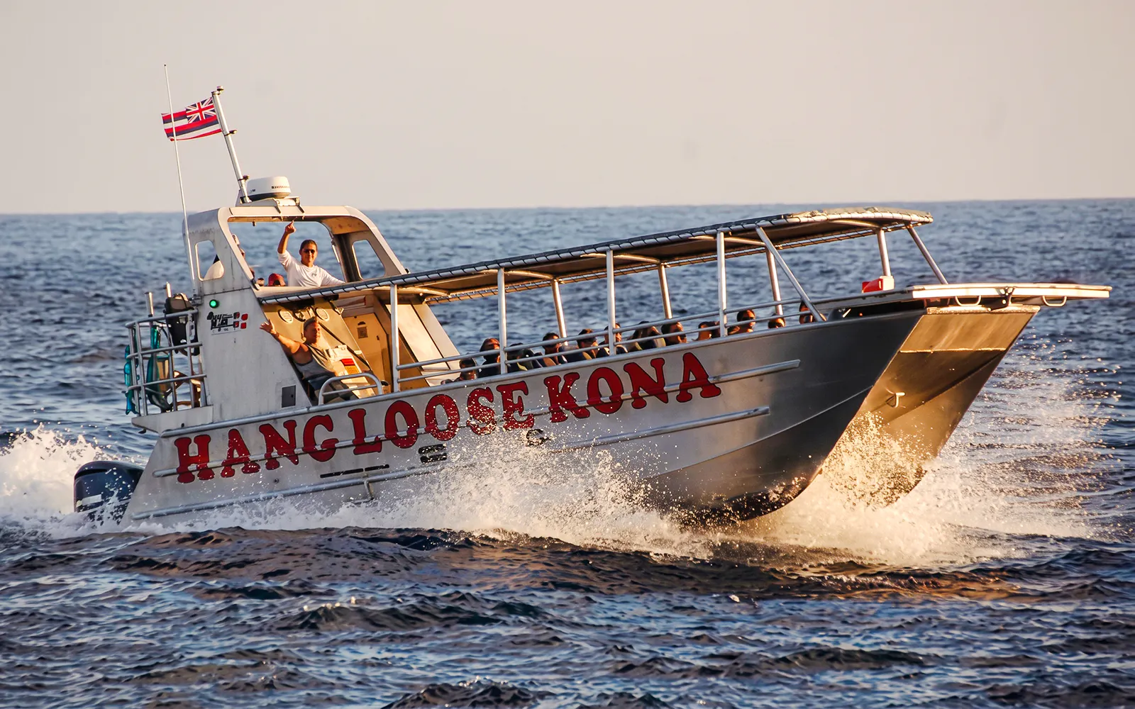 Tour boat "Hang Loose Kona" on Big Island waters for Manta Ray Night Snorkel.