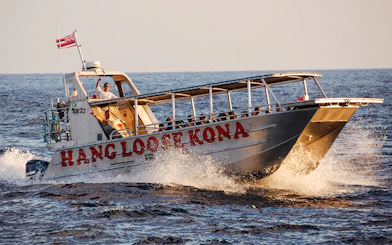 Tour boat "Hang Loose Kona" on Big Island waters for Manta Ray Night Snorkel.