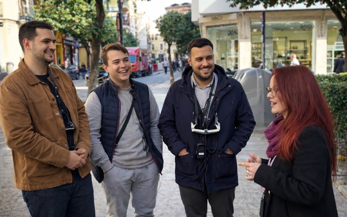 Tourists with guide during Setas de Sevilla city tour.