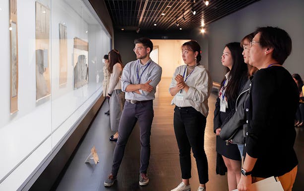Visitors viewing art at the National Museum of Modern Art, Tokyo.