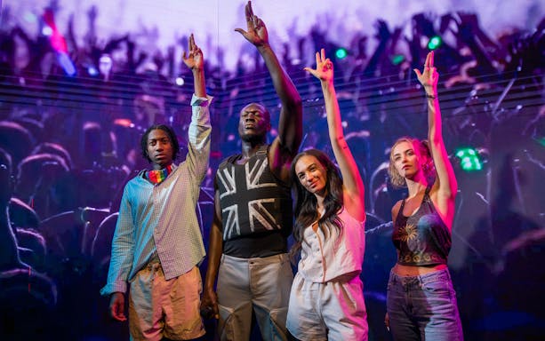 Stormzy wax figure with three people at Madame Tussauds London.