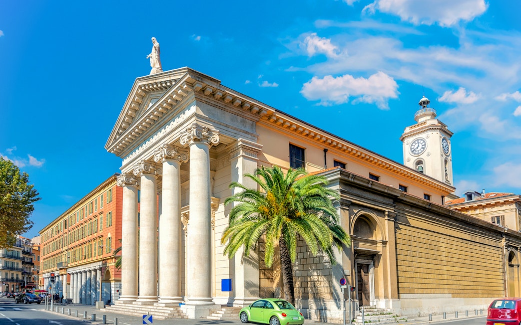 Nice city architecture with columns and clock tower on a self-guided audio tour.
