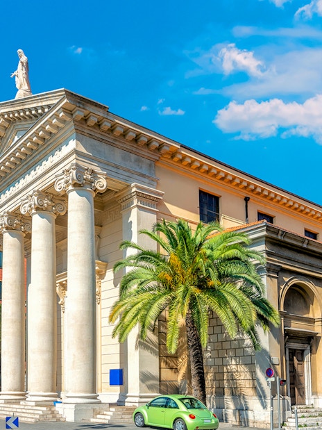 Nice city architecture with columns and clock tower on a self-guided audio tour.