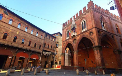 Bologna historic building in city square, part of self-guided murder mystery game.