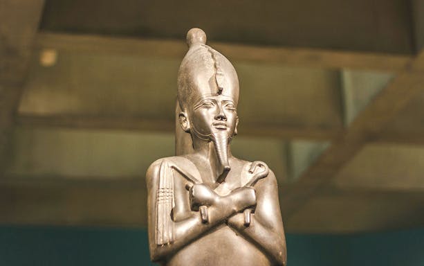 Statue of an ancient Egyptian pharaoh at the Egyptian Museum of Antiquities.
