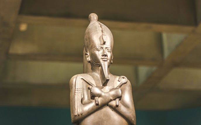 Statue of an ancient Egyptian pharaoh at the Egyptian Museum of Antiquities.