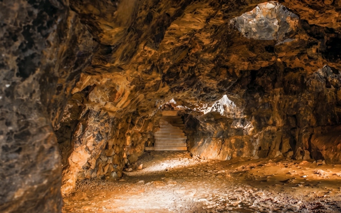 Dragon's Den cave interior with stone steps, Wawel Castle, Kraków, Poland.