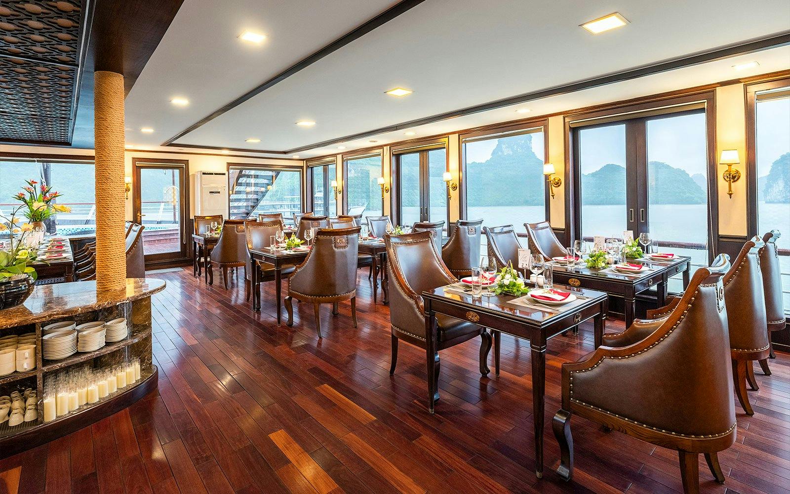 Restaurant dining area on Amanda Luxury Cruise with elegant tables and sea view.
