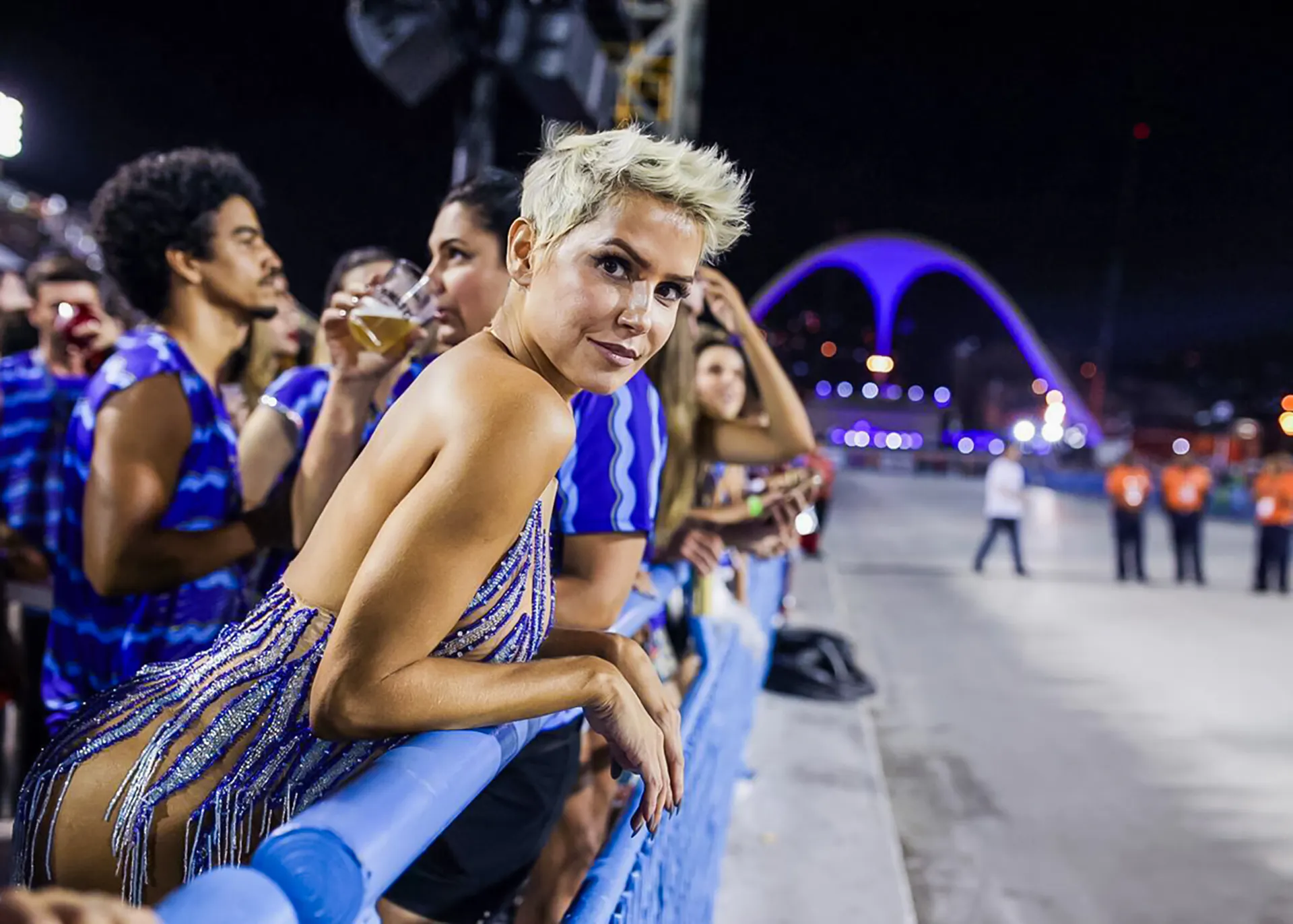 Spectators enjoying Rio Carnival 2027 from VIP box at Marquês de Sapucaí, Rio de Janeiro.