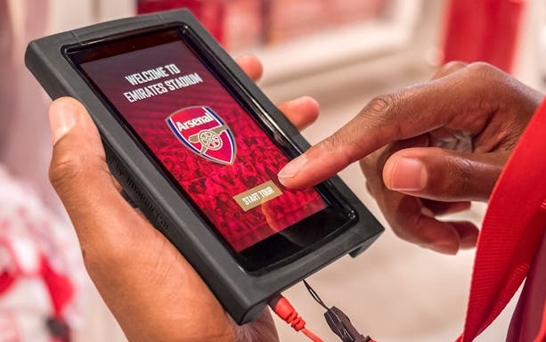 Touchscreen device displaying Arsenal FC Emirates Stadium tour start page.
