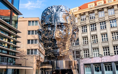 Rotating Kafka head sculpture near Franz Kafka Museum, Prague.