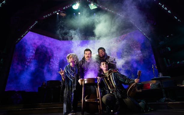 Actors in fantasy costumes perform in a smoky tavern setting for Dungeons & Dragons: The Twenty-Sided Tavern.