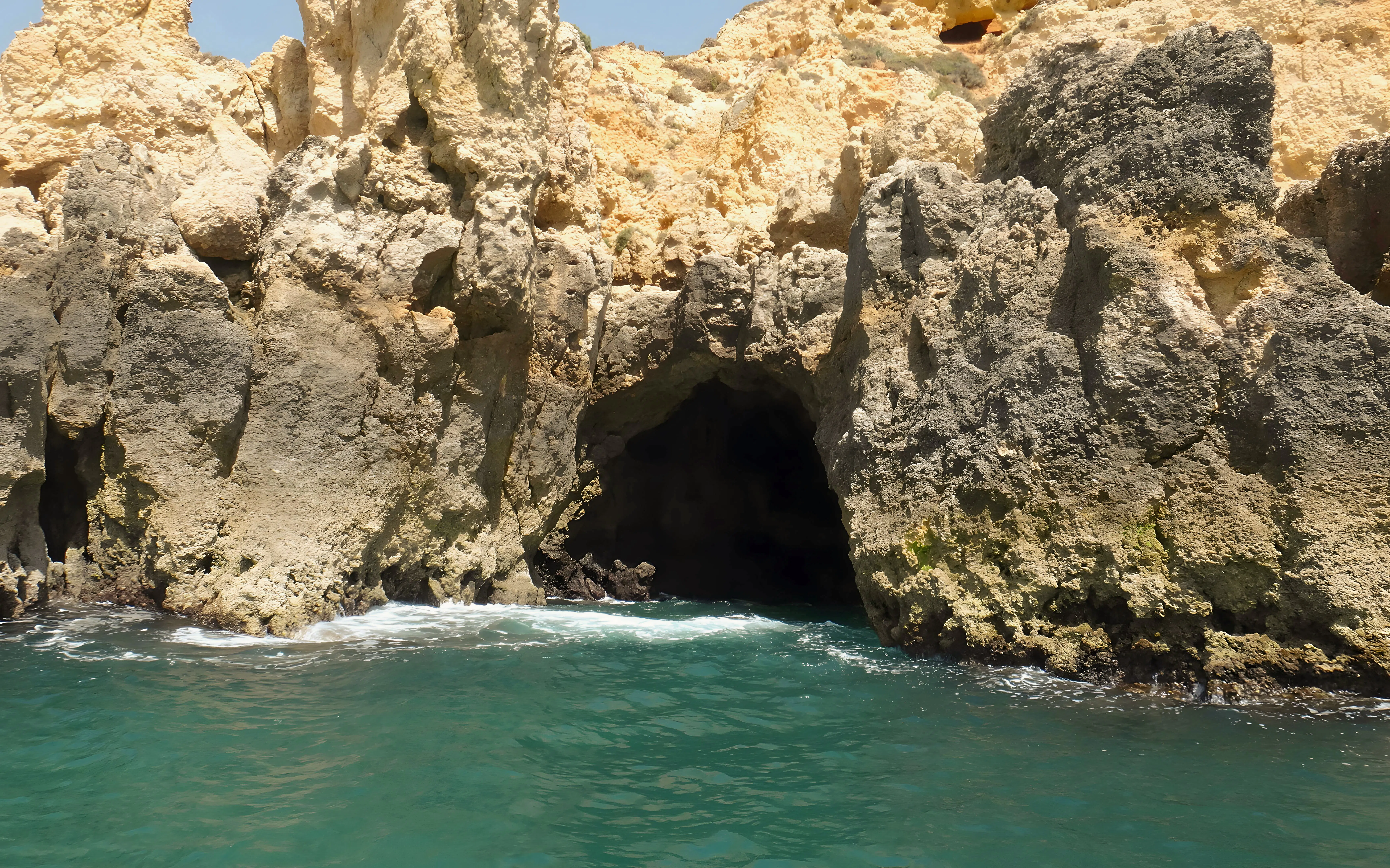 Cave entrance at Ponta da Piedade with turquoise water on a private cruise.