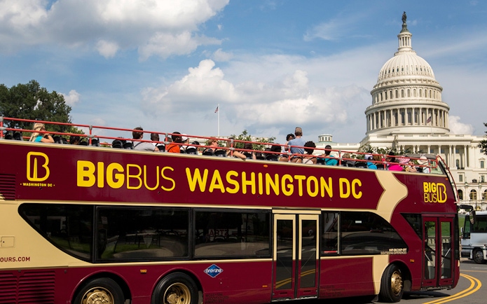 Big Bus tour in Washington DC passing by the US Capitol building.