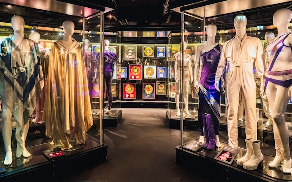 Costumes and gold records on display at ABBA Museum in Stockholm, Sweden.