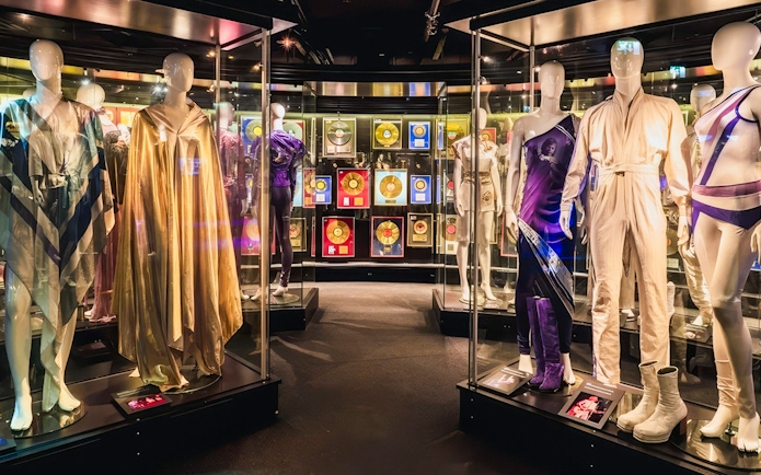 Costumes and gold records on display at ABBA Museum in Stockholm, Sweden.