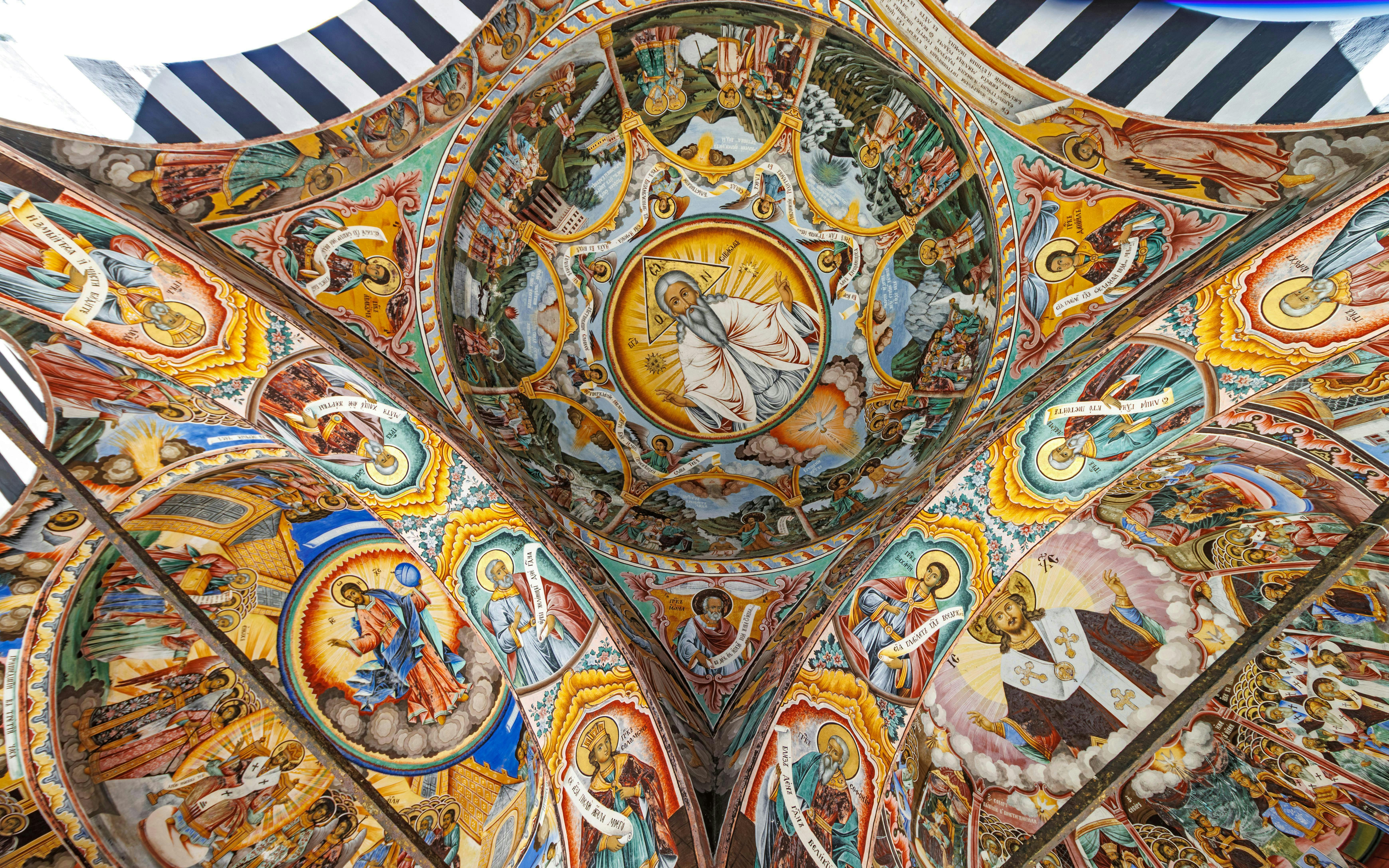Richly decorated frescoes on the ceiling of Rila Monastery, Rila Mountains, Bulgaria.