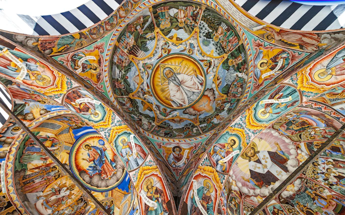 Richly decorated frescoes on the ceiling of Rila Monastery, Rila Mountains, Bulgaria.
