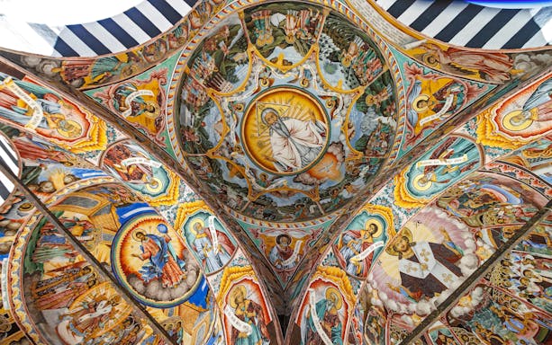 Richly decorated frescoes on the ceiling of Rila Monastery, Rila Mountains, Bulgaria.