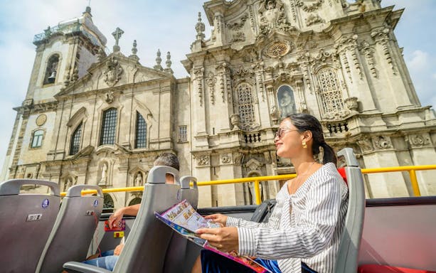 Passenger on Porto HOHO tour bus viewing Clerigos Church.